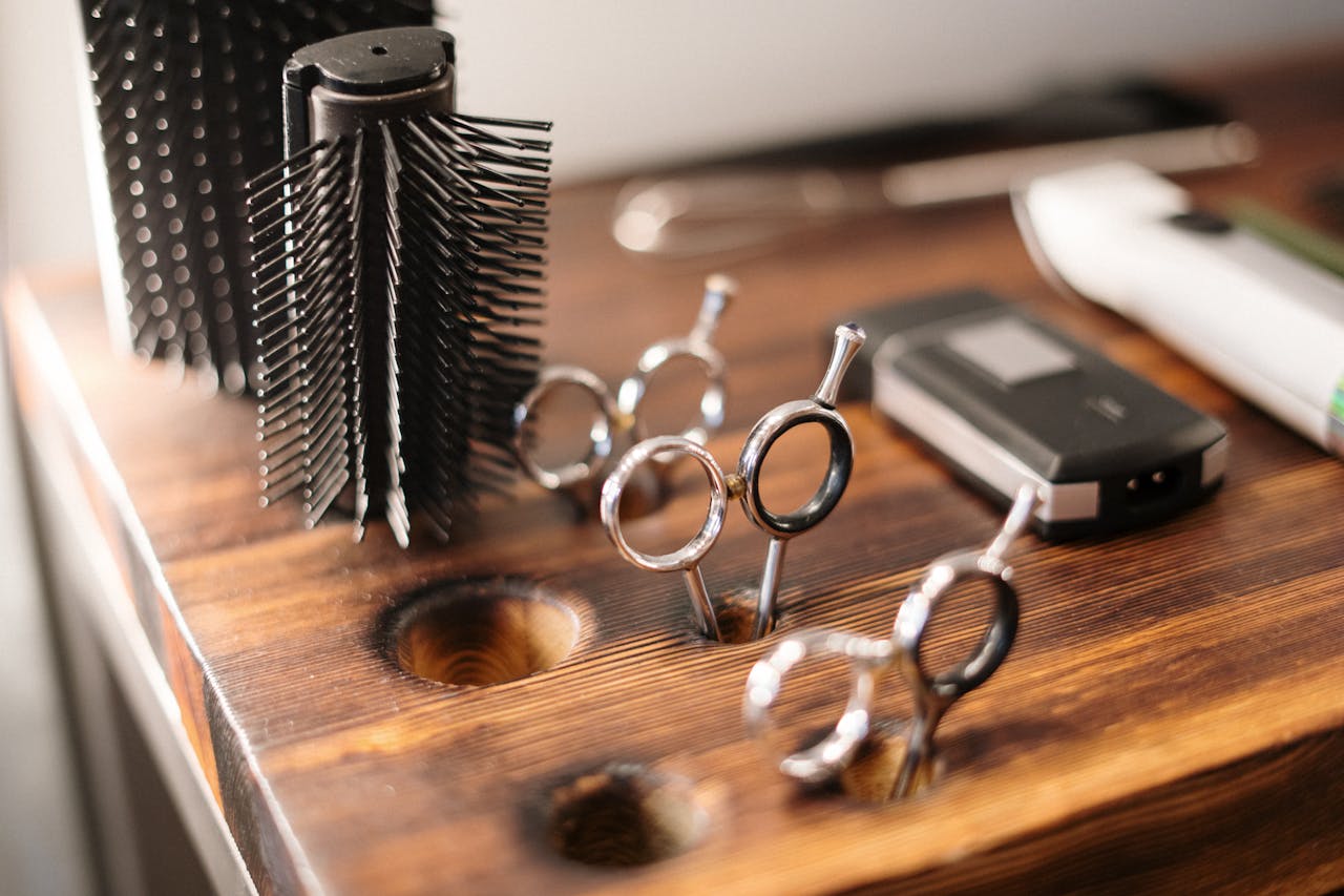 Crafting Captivating Headlines: Your awesome post title goes here Close-up of barber tools on a stylish wooden counter, perfect for a salon setting.
